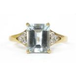 A gold aquamarine and diamond ring,