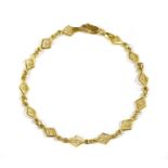 A 22ct gold lozenge link bracelet,