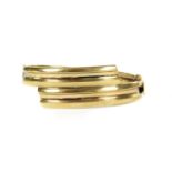 A 9ct gold oval hinged crossover bangle,
