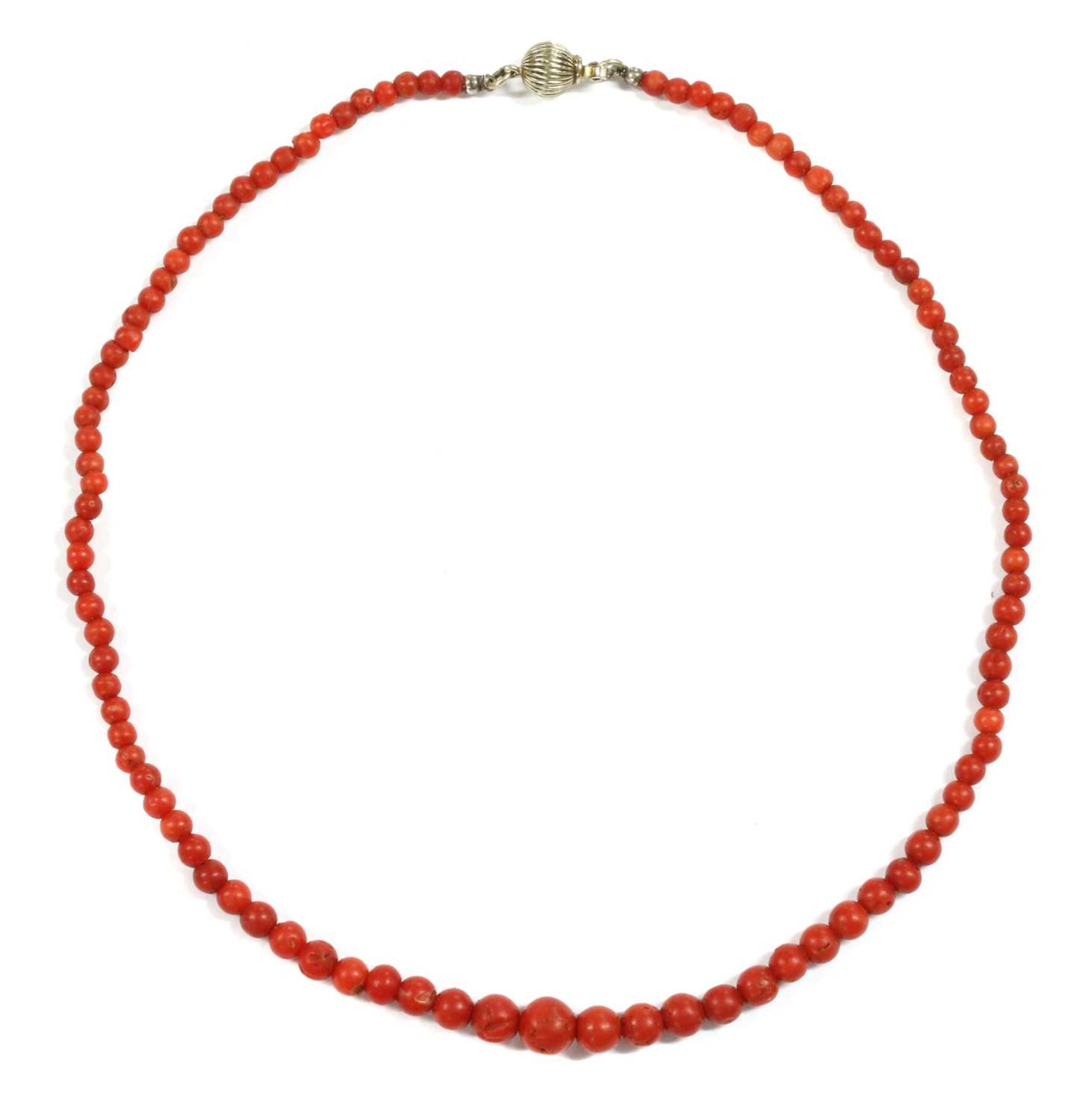 A single row graduated coral bead necklace,