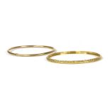 A 9ct gold hollow round section bangle,