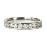 A white gold diamond half eternity ring,