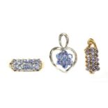 A 9ct white gold tanzanite cluster pendant,