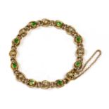 A Victorian gold demantoid garnet and split pearl curb bracelet,