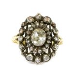 A gold and silver diamond oval cluster ring,