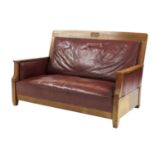 An Arts & Crafts oak settee,