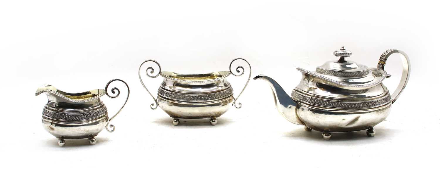 A Regency silver three piece tea service by Samuel Hennell, London,