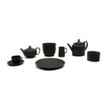 A collection of 19th century and later Wedgwood black basalt items,