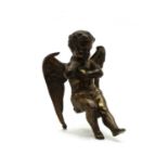 A 19th century bronze model of a seated cherub,