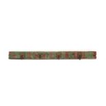 An Indian carved wood and polychrome decorated rack of four coat hooks,