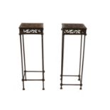 A pair of wrought iron stands,