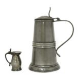 A large pewter tankard,