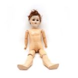 A Schoenau & Hoffmeister bisque headed doll,