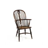 A late 18th/early 19th century yewood and elm Windsor elbow chair,