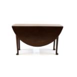 A George lll oval walnut two flap table