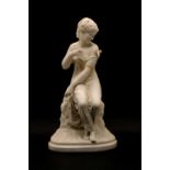 A parian group depicting a seated girl,