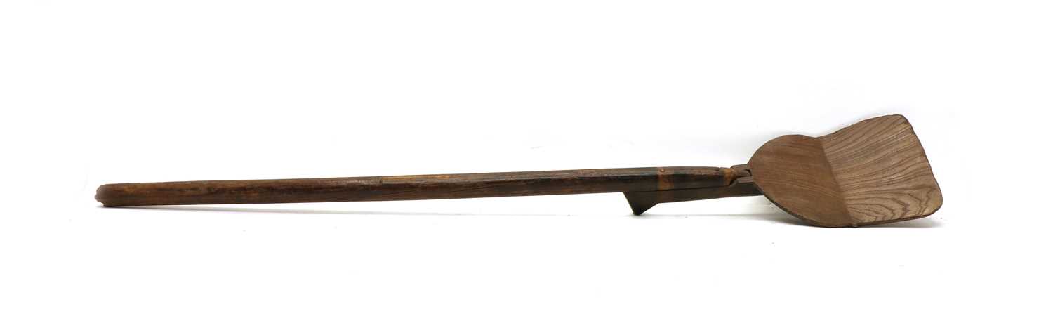 A 19th century elm and ash two piece malt shovel,