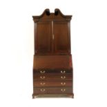 A reproduction mahogany bureau bookcase