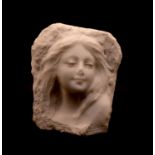 A carved marble bust in relief of a young woman,