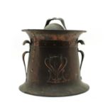 An Arts and crafts copper coal bin