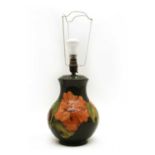 A Moorcroft tubeline decorated 'Hibiscus' pattern table lamp,