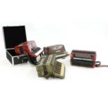 A collection of four accordions,