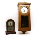 An Edwardian mahogany and crossbanded wall clock,