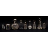 A collection of cut glass silver topped scent bottles,