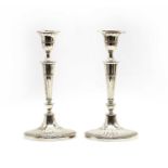 A pair of Regency-style silver-plated candlesticks