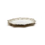 A silver salver with C scroll shell border