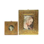 Two similar teak and brass inlaid frames,