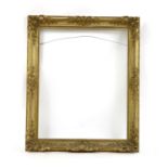 A 19th century gilt gesso scroll moulded and swept portrait frame,