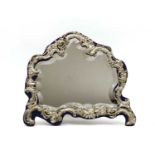 A silver framed dressing mirror of Rococo design