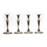 A set of four George III Sheffield Plated candlesticks of Adam design