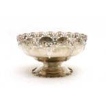 A silver pierced bowl on spreading pedestal foot,