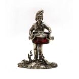 A silver plated novelty inkwell,