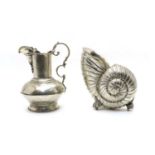 A large silver plated vase in the form of a nautilus shell,