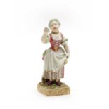 A porcelain figure of a lady singing,