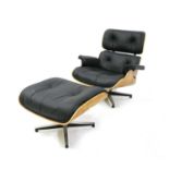 A modern walnut lounger and ottoman,