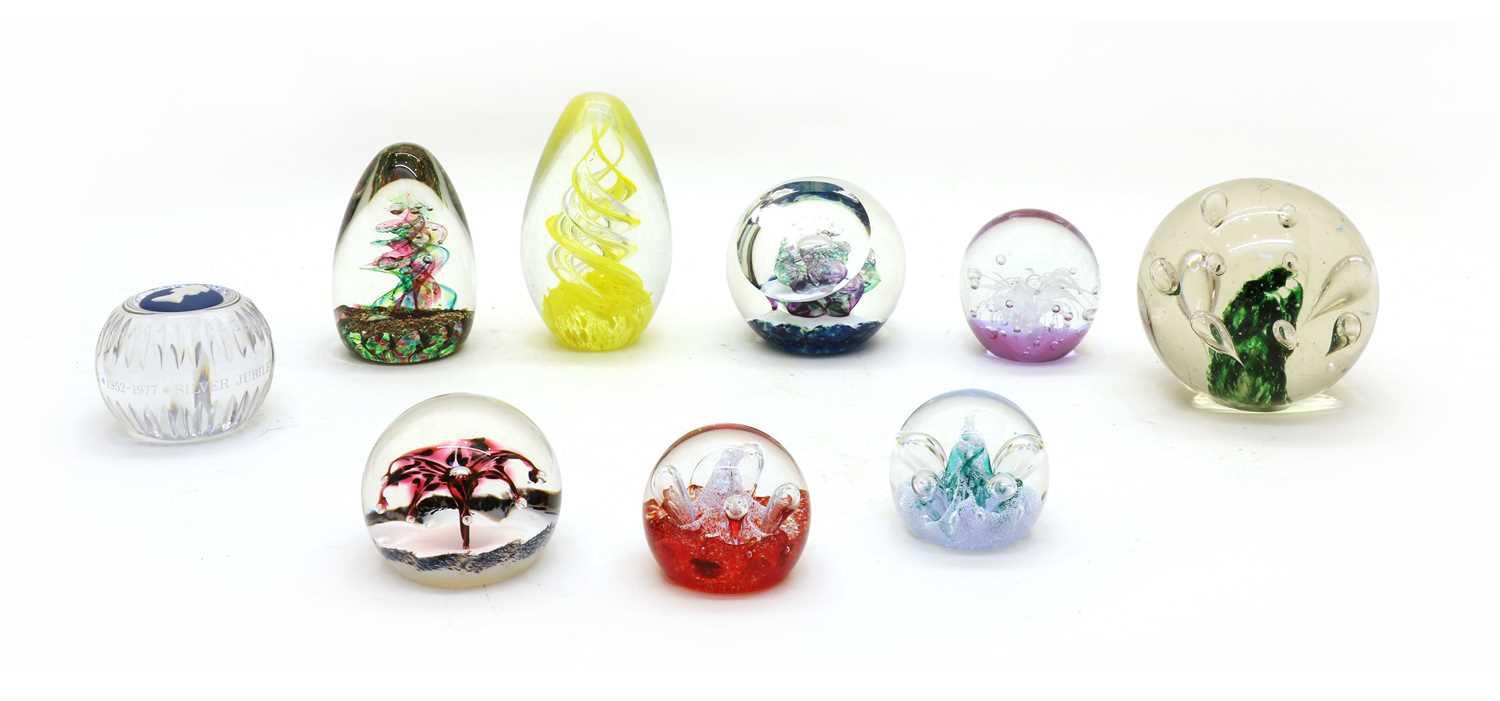 A collection of glass paperweights and dump weights,