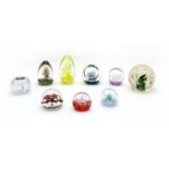 A collection of glass paperweights and dump weights,