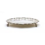 An Edwardian silver salver of circular form,