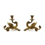 A pair of brass candlesticks,