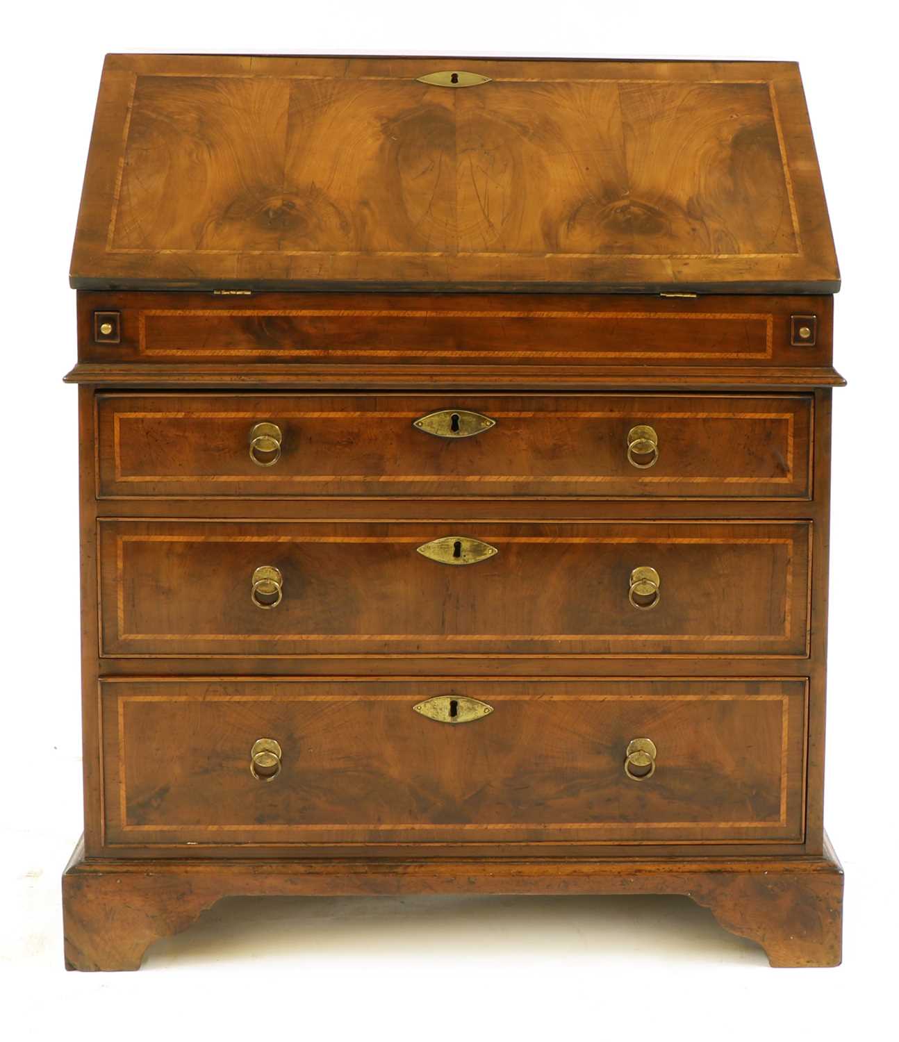 A yew, crossbanded and feather-banded bureau,