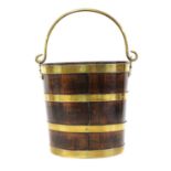 A George III mahogany and brass bound peat bucket,