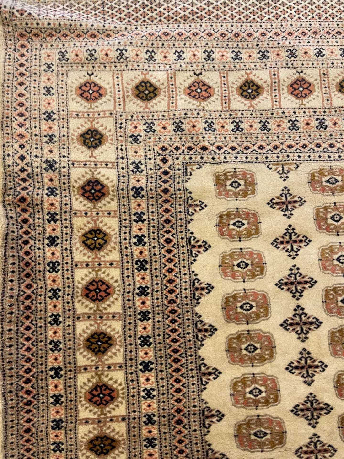 A Bokhara design carpet, - Image 9 of 13