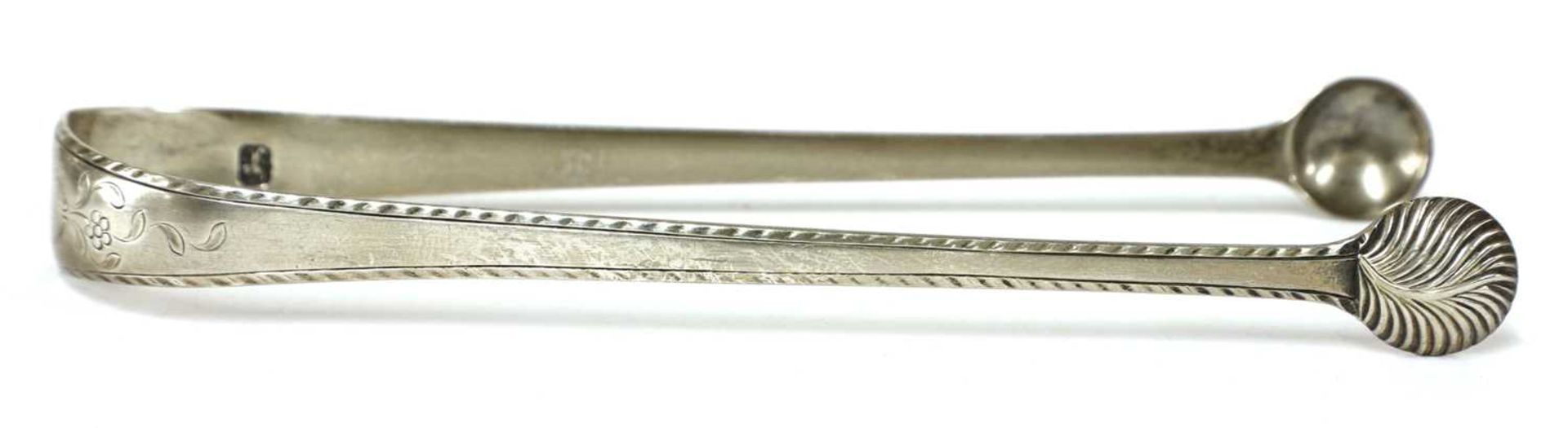 A pair of George III silver sugar tongs, - Image 16 of 28