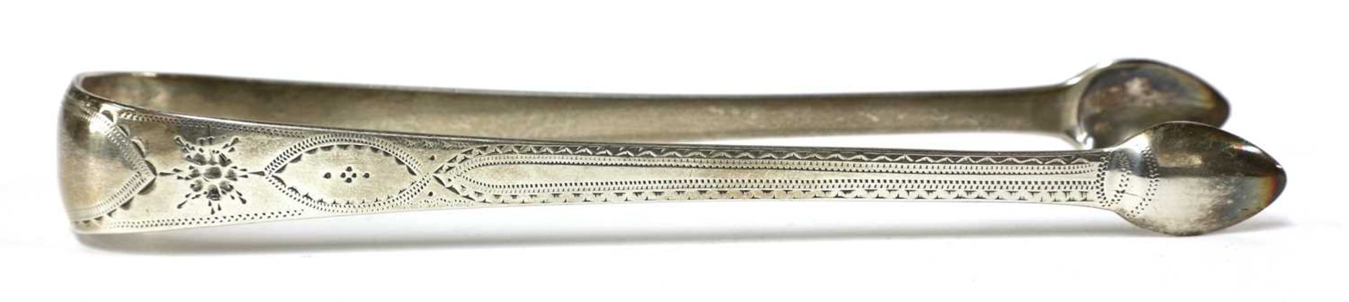 A pair of George III silver sugar tongs, - Image 6 of 33