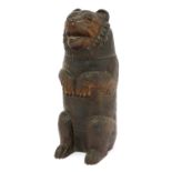 A Black Forest tobacco box in the form of a bear,