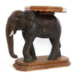 An Indian sandalwood occasional table in the form of an elephant,